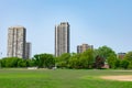 Green Open Field in Lincoln Park Chicago with Buildings Royalty Free Stock Photo