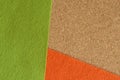 Green and orange felt fabric on the brown recycle board for background.