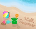 Green orange pink blue Beach toy and colorful beach ball on the beach. Hello Summer on the sand with the blue tone of wave. Royalty Free Stock Photo