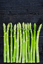 Green organic asparagus. Black background, top view, space for text. Royalty Free Stock Photo