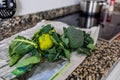 Green organic green cauliflower and broccoli on a kitchen countertop in close-up