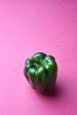 Green organic fresh pepper on pink background with copy space Royalty Free Stock Photo