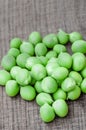 Green organic peas on wooden background Royalty Free Stock Photo