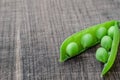 Green organic peas on wooden background Royalty Free Stock Photo