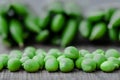 Green organic peas on wooden background Royalty Free Stock Photo