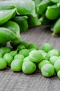 Green organic peas on wooden background Royalty Free Stock Photo