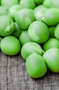 Green organic peas on wooden background Royalty Free Stock Photo