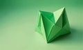 green origami sculpture, composed triangular and square paper pieces, is displayed against gradient green