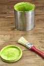 Close-up of a green paint can and brush Royalty Free Stock Photo