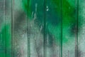 Green paint spot old dirty fence surface weathered texture background