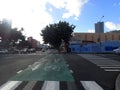 Green Painted King Street Protected Bike Lane intersecting Punahou street with cars on road