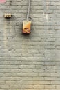 Green painted old brick wall with control box and button Royalty Free Stock Photo