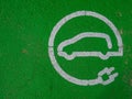 GREEN PAINTED SIGN ON THE GROUND FOR ELECTRIC VEHICLE RECHARGING Royalty Free Stock Photo