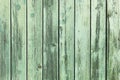 Green painted wooden wall plank perpendicular to the frame simple blue paint timber old grungy wood surface texture background