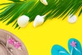 Green Palm Leaf White Sea Shells Straw Hat Blue Slippers On Yellow Background. Summer Tropical Beach Vacation Travel Concept