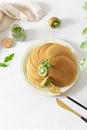Green pancakes with matcha tea. Ideas and recipes for healthy breakfast with superfood ingredients. Menu, matcha recipe. Top view Royalty Free Stock Photo