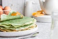 Green pancakes with matcha tea and mango jam Royalty Free Stock Photo