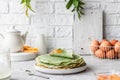 Green pancakes with matcha tea and mango jam Royalty Free Stock Photo