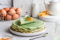 Green pancakes with matcha tea and mango jam Royalty Free Stock Photo