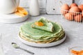 Green pancakes with matcha tea and mango jam Royalty Free Stock Photo