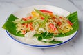 Green papaya salad close up on a plate, Thai cuisine