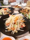 Green papaya salad with tomato chilli and garlic, add shrimps Serve with vegetables on the table, Thai food Taste sour sweet spicy Royalty Free Stock Photo