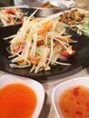 Green papaya salad with tomato chilli and garlic, add shrimps Serve with vegetables on the table, Thai food Taste sour sweet spicy Royalty Free Stock Photo