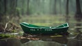 green paper boat on the lake A scary paper boat with the word fear written on it, drifting on a green swamp with fog