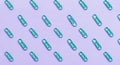 Green Paper Clips Arranged in Diagonal Pattern on Pastel Purple Background Royalty Free Stock Photo