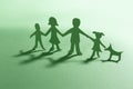 Green Paper family with dog Royalty Free Stock Photo