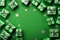 Green paper gift boxes on green background. Green friday, sustainable consumption, sustainability, zero waste concept. Top view.