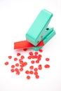Green paper punches with red paper Royalty Free Stock Photo