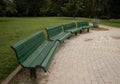 Green park benches in a park