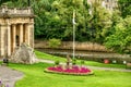 Green park and buildings along River Avon, Bath, England