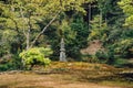 Green park with a monument and stone rock statue Royalty Free Stock Photo