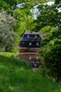 Green park with ponds and old water mill in central part of Eindhoven city, North Brabant, Netherlands in spring time