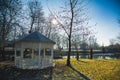 Green park in winter season with arbor or bower