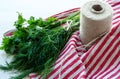 Green parsley and dill leaves on natural linen napkin on wooden background Royalty Free Stock Photo