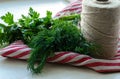 Green parsley and dill leaves on natural linen napkin on wooden background Royalty Free Stock Photo