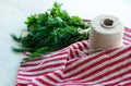 Green parsley and dill leaves on natural linen napkin on wooden background Royalty Free Stock Photo