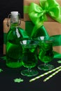 Green party beverages in irish glasses and bottle