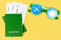 Green passport, boarding pass, flight ticket, sunglasses, airplane, sun blue sky, summer holiday, vacation, travel Royalty Free Stock Photo