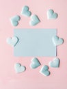 Green pastel card hearts on pink textured background Royalty Free Stock Photo