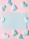 Green pastel card hearts on pink textured background Royalty Free Stock Photo