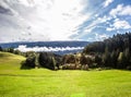 Green pasture lands in the Italian Alps.