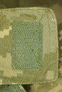 green patch velcro on spotted military clothing Royalty Free Stock Photo