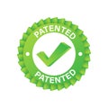 Green patented label on blue ribbon on white background. Vector stock illustration. Royalty Free Stock Photo