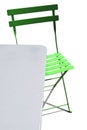 Green patio chair and metal table Royalty Free Stock Photo