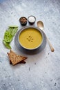 Green pea cream soup in grey bowl Royalty Free Stock Photo