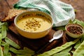 Green pea cream soup in grey bowl Royalty Free Stock Photo